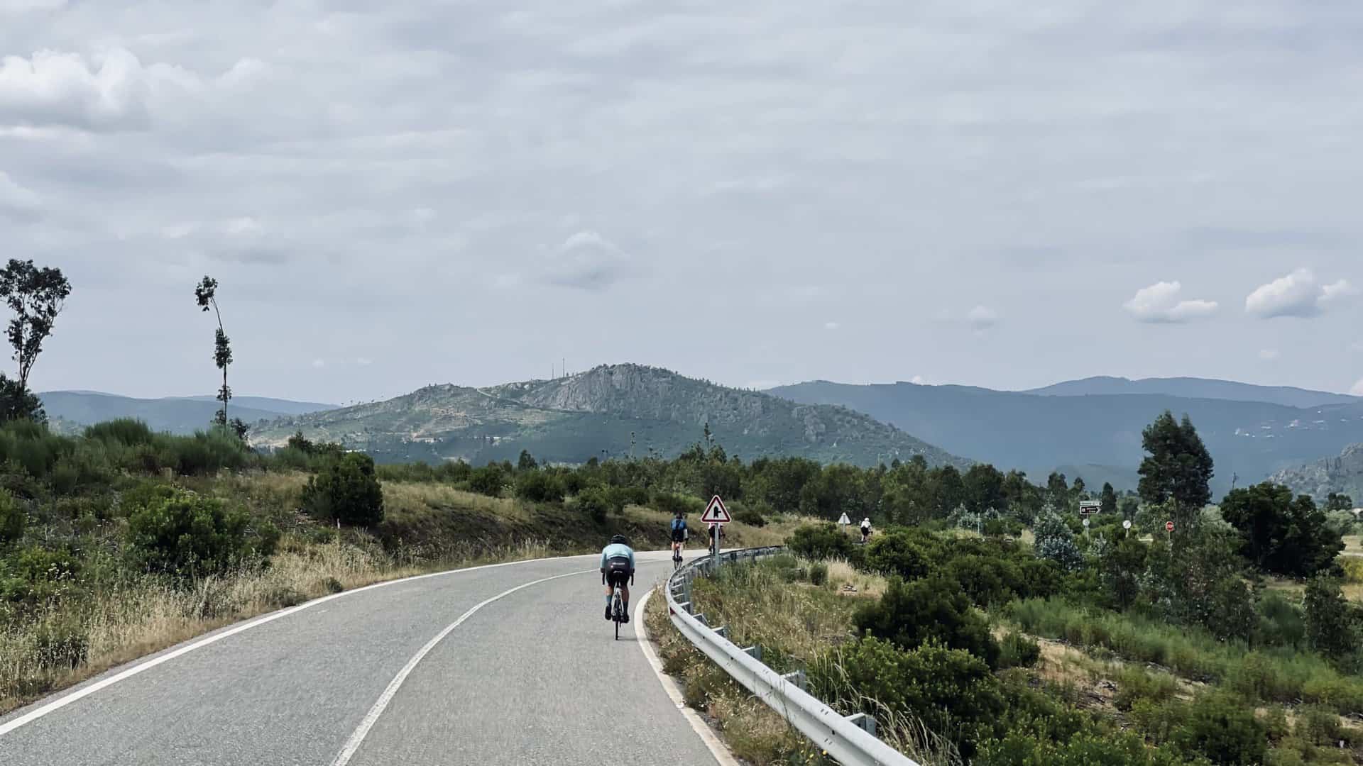 road cycling in portugal Cyclist with mountain backdrop
